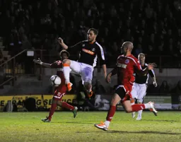 Robbie Willmott showing his balletic poise but it ends 1-1 instead of tutu