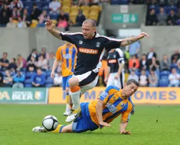 Keith Keane battles away in what will become a fifth draw in six matches under new boss Gary Brabin