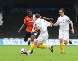 Curtis Osano is closed down by future Hatter Sean Whalley