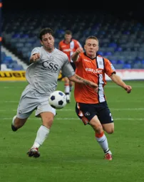 Adam Watkins in a chase for the ball