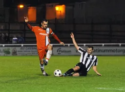 Alex Lawless avoids a sliding tackle