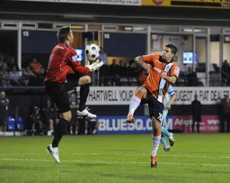 Danny Naisbitt gathers the ball away from Danny Crow