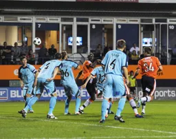 Will Antwi heads the ball towards goal but no result