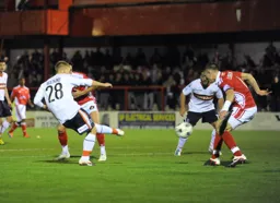 Adam Watkins tries to add to the score