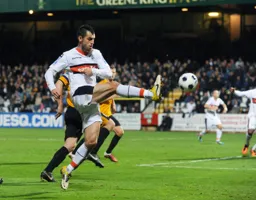 Alex Lawless hits the ball on the volley