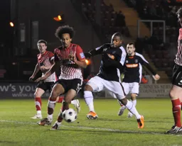 Aaron O`Connor closes down on Josh Gowling