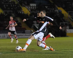 Robbie Willmott goes at full stretch for the ball