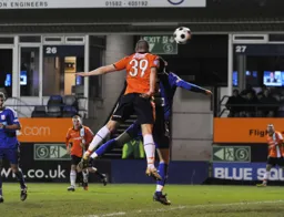 Tommy Wright rises to head in the second goal