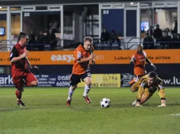 Adam Watkins gets past the keeper but cannot finish it off