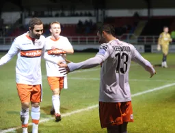 Robbie Willmott and Adam Watkins join Stuart Fleetwood to celebrate his goal