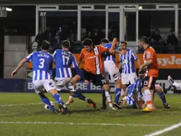 James Dance and Stuart Fleetwood involved in a goalmouth scramble