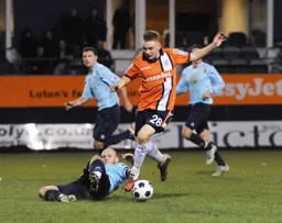 Adam Watkins gets past former Hatter Adam Murray