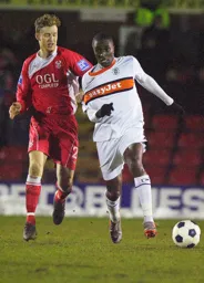 Curtis Osano gets away from Micky Demetriou