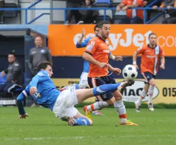 Stuart Fleetwood is stopped by Chris Smith`s last ditch tackle
