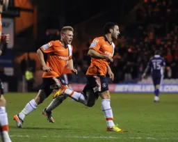 Stuart Fleetwood wheels away to celebrate the first goal. Adam Watkins is in hot pursuit to join in