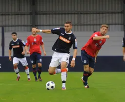 Greg Taylor brings the ball forward