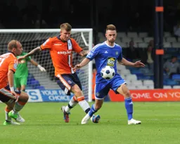 Dean Beckwith attempts to win the ball