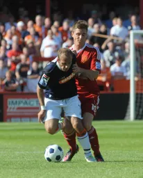 Jake Howells comes under pressure from Dan Bradley