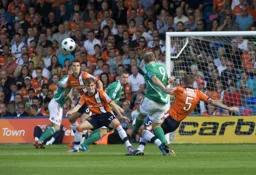 JJ O`Donnell looks on as Dean Beckwith blocks a Wrexham attack