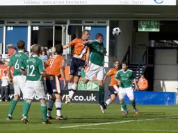 Scott Rendell rises highest to send a header towards goal