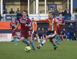 JJ O`Donnell takes the ball past Danny Sleath