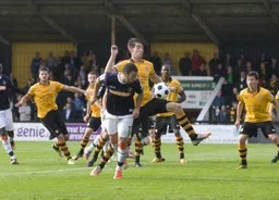 Stuart Fleetwood sends a header towards goal