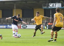Matt Robinson hammers a shot at goal