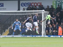 Dean Brill has to be alert as Jamie Turley heads the ball towards goal