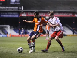 Alex Lawless shields the ball away from Connor Franklin