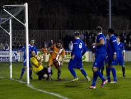 Stuart Fleetwood makes his presence felt as Jon Kennedy holds on to the ball