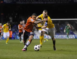 Andre Gray forces his way through