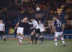 Janos Kovacs heads the ball forwards