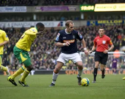 Jake Howells looks for a way past Leon Barnett
