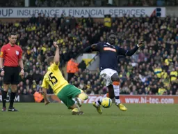 Arnaud Mendy takes the ball past David Fox