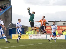 Danny Hurst catches the ball in front of Jon Shaw