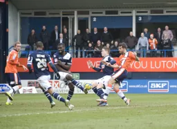 Surrounded by three defenders Alex Lawless manages to get a shot at goal