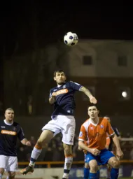 Alex Lawless gets his head to the ball