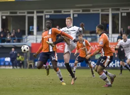 Arnaud Mendy attempts to hold off his marker