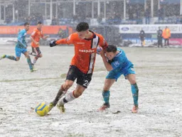 Alex Wall battles his way through the snow