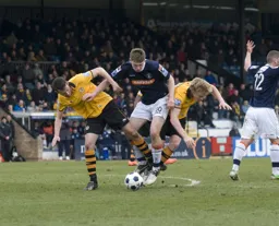 Jake Goodman fights for the ball in a tangle of legs