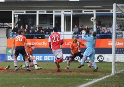 Danny Lewis gets his finger tips to the ball from P 1182 Jon Shaw`s close range effort