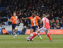 Solomon Taiwo moves the ball past Danny Pilkington