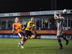 Alex Wall lifts the ball over the keeper for his and Town`s second goal