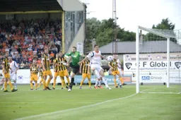 Alex Lacey watched on as the ball goes wide