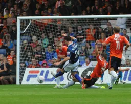 Alex Lacey makes a sliding challenge