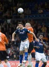 Steve McNulty heads clear