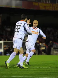 Luke Guttridge high 5's Shaun Whalley