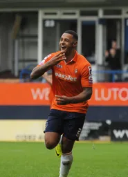 Andre Gray celebrates his hat-trick