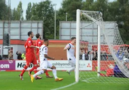 Andre Gray and Alex Lacey show their joy as Paul Benson heads in the Hatters 3rd