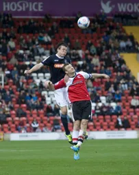 Matthew Robinson wins the header